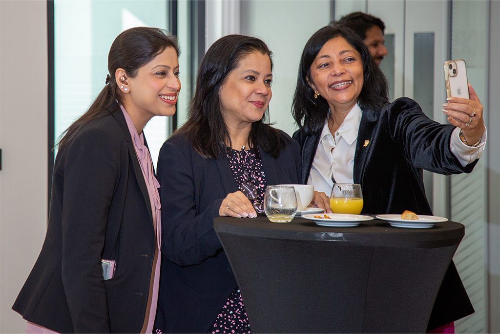 3 women capturing a joyful moment at Connexus event